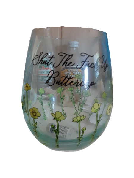drinking glass with flowers that says 'Shut the Fuck Up Buttercup' with a testosterone vial in it