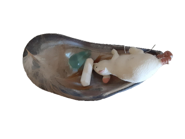 mussel shell with feather, chalk, blue glass and white rubber mouse