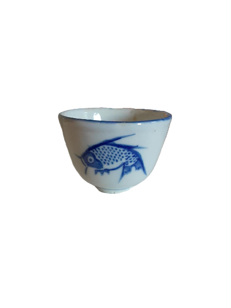 ceramic dish with painted blue fish